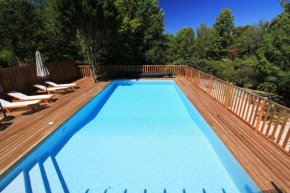 Wood-frame lodge with terrace and pool